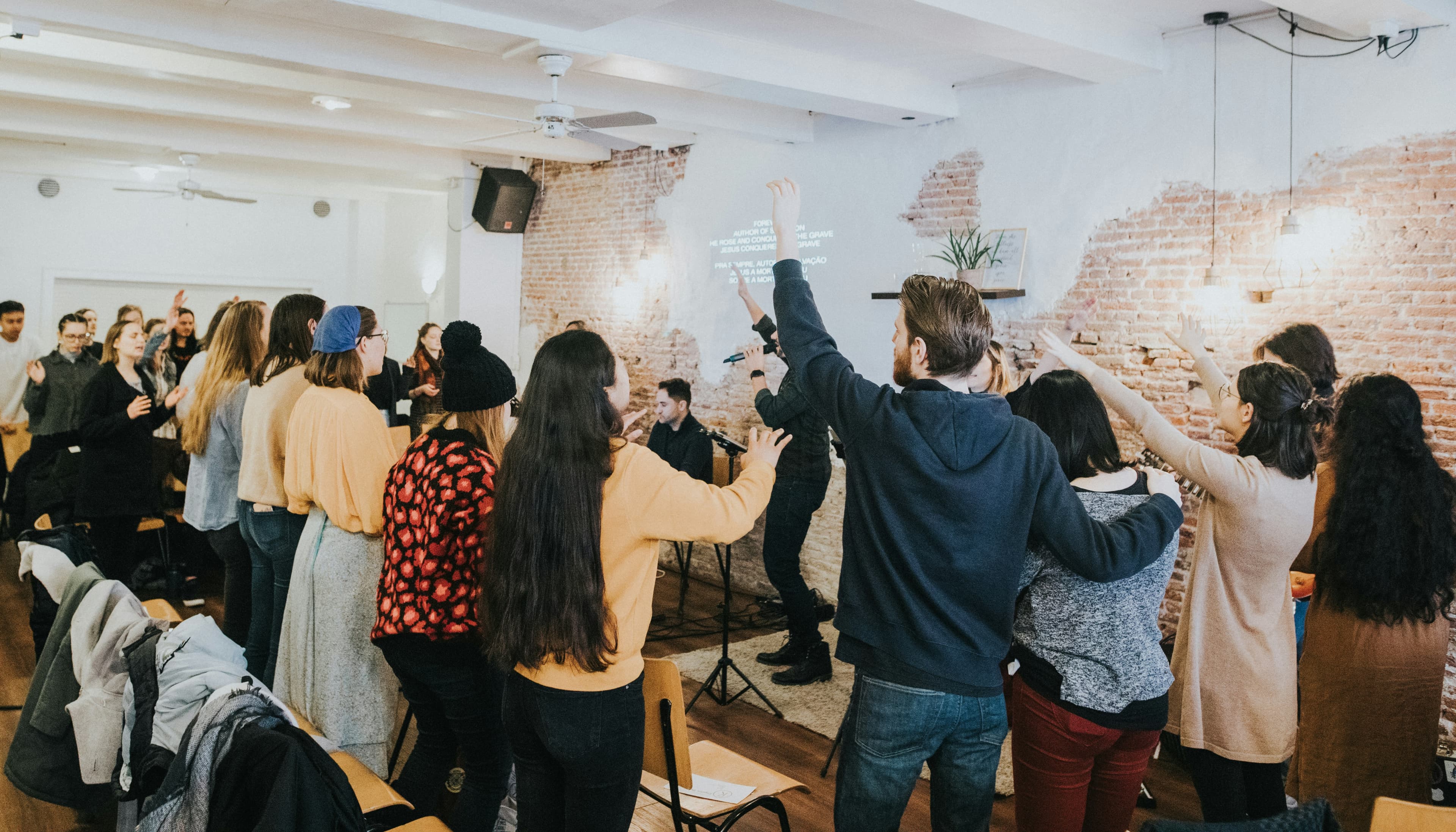 Small church congregation worshiping together